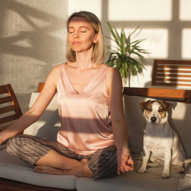 meditating woman with dog